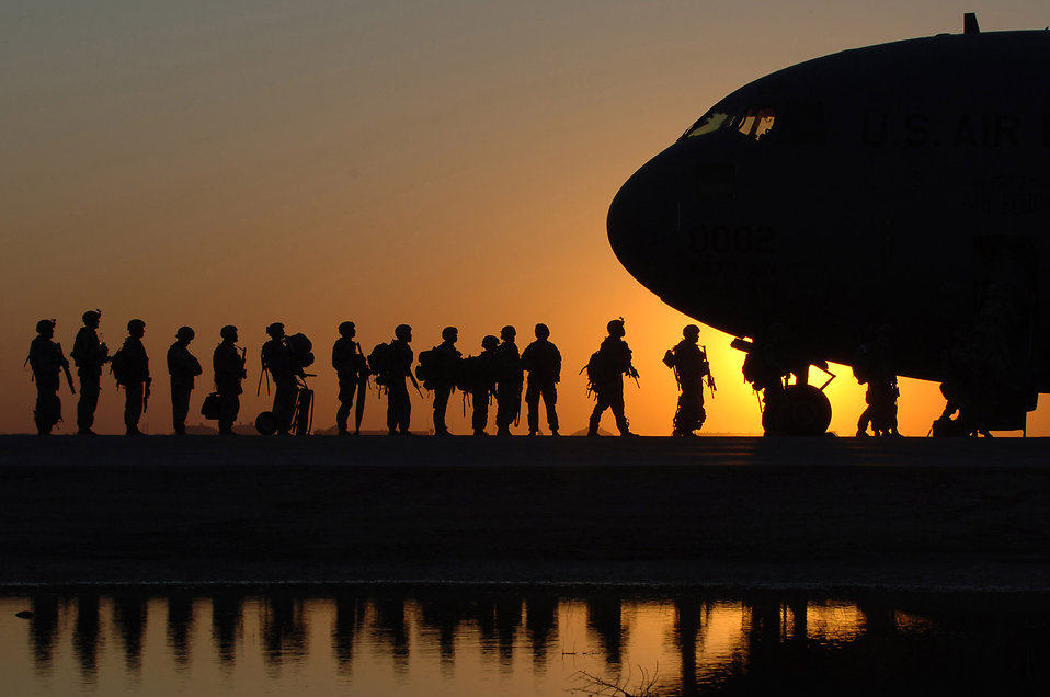 The sun sets behind a C-17 Globemaster III Nov. 17 at Joint Base Balad, Iraq, as Soldiers begin boarding. C-17s can carry payloads up to 169,000 pounds and can land on small airfields. The C-17 is deployed from the 437th Airlift Wing at Charleston Air Force Base, S.C.