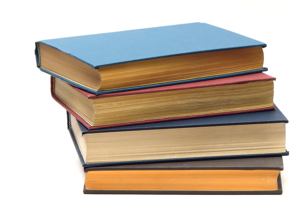 A stack of books isolated on a white background.