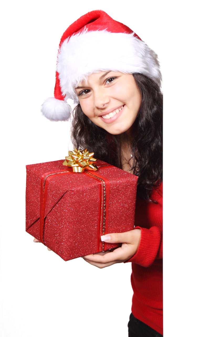 A beautiful young woman with a Christmas present.