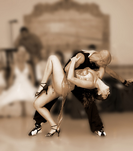black and white pictures of people dancing. A couple dancing.
