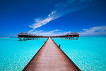 Free Stock Photo: A bridge leading to water bungalows on the ocean