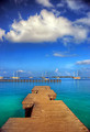 Free Stock Photo: View from a wooden pier overlooking sailboats in the ocean
