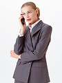 Free Stock Photo: A beautiful blonde businesswoman on a cell phone isolated on a white background
