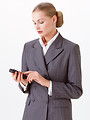 Free Stock Photo: A beautiful blonde businesswoman in a suit checking a cell phone isolated on a white background