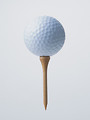Free Stock Photo: A golf ball on a tee isolated on a white background