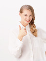 Free Stock Photo: A beautiful blonde winking and giving a thumbs up symbol isolated on a white background