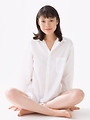Free Stock Photo: A beautiful woman sitting with crossed legs isolated on a white background