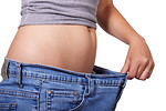 Free Stock Photo: A woman showing off loose jeans