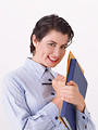 Free Stock Photo: A beautiful woman holding a binder and pen isolated on a white background