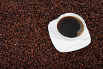 Free Stock Photo: A cup of coffee on a bean background