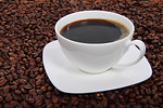 Free Stock Photo: A cup of coffee on a bean background