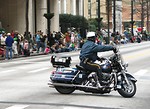 Free Stock Photo: A police officer on a motorcycle clearing the street for the 2010 Saint Patricks Day Parade in Atlanta, Georgia