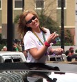 Free Stock Photo: A beautiful woman passing out goodies in the 2010 Saint Patricks Day Parade in Atlanta, Georgia