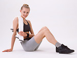 Free Stock Photo: A beautiful blonde exercising isolated on a white background