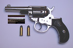 Free Stock Photo: A colt 1877 Lightning pistol with bullets