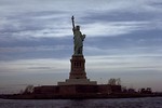 Free Stock Photo: View of the Statue of Liberty monument on Liberty Island at dusk
