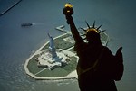 Free Stock Photo: Aerial view of the Statue of Liberty monument on Liberty Island with a superimposed silhouette