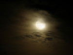 Free Stock Photo: The moon shining through clouds at night