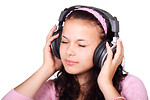Free Stock Photo: A beautiful girl listening to music with headphones