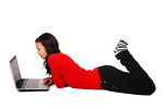 Free Stock Photo: A beautiful girl lying on the floor with a laptop isolated on a white background