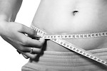 Free Stock Photo: A woman measuring her belly