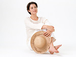 Free Stock Photo: A beautiful brunette in casual clothes with a hat isolated on a white background