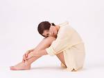 Free Stock Photo: A beautiful brunette in a nightshirt isolated on a white background