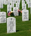 Free Stock Photo: Gravestones and an American flag at the Georgia National Cemetery