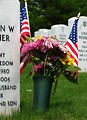 Free Stock Photo: Close-up of gravestones and an American flag at the Georgia National Cemetery