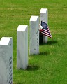 Free Stock Photo: Gravestones and an American flag at the Georgia National Cemetery