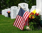 Free Stock Photo: Close-up of gravestones and an American flag at the Georgia National Cemetery