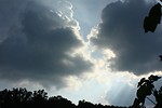 Free Stock Photo: Rays of sunlight shining through the clouds