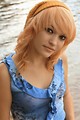 Free Stock Photo: A beautiful young woman posing by a lake