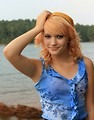 Free Stock Photo: Portrait of a beautiful young woman posing by a lake
