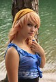 Free Stock Photo: A beautiful young woman posing by a lake