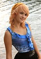 Free Stock Photo: A beautiful young woman posing by a lake.