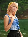 Free Stock Photo: A beautiful young woman posing by a lake
