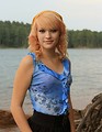 Free Stock Photo: Portrait of a beautiful young woman posing by a lake