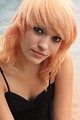 Free Stock Photo: Close-up portrait of a beautiful young woman posing by a lake