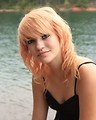 Free Stock Photo: Close-up portrait of a beautiful young woman posing by a lake