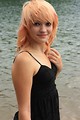 Free Stock Photo: A beautiful young woman posing by a lake