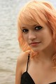 Free Stock Photo: Close-up portrait of a beautiful young woman posing by a lake