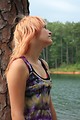 Free Stock Photo: A beautiful young woman posing by a lake