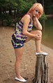 Free Stock Photo: A beautiful young woman posing by a lake
