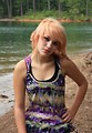 Free Stock Photo: A beautiful young woman posing by a lake