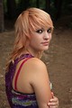 Free Stock Photo: A beautiful young woman posing by a lake