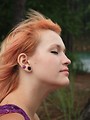 Free Stock Photo: A beautiful young woman posing with her hair blowing in the wind