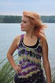 Free Stock Photo: A beautiful young woman posing by a lake