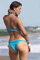 Free Stock Photo: A beautiful woman in a blue bikini by the ocean
