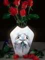 Free Stock Photo: A vase with a bouquet of red roses